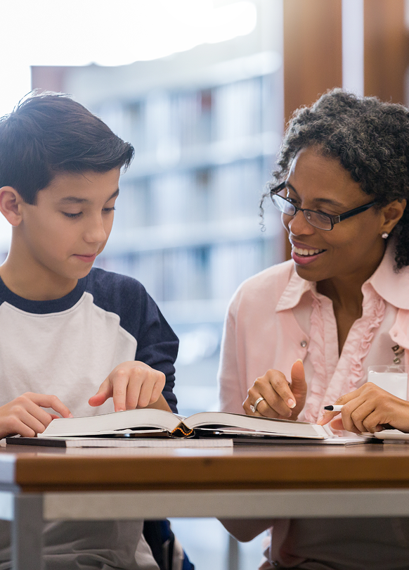 boy student learning from teacher